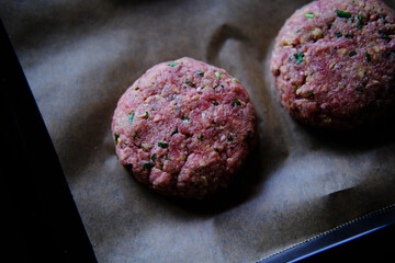 Preparing burger patties, raw burger meat. Concept for making homemade burgers.