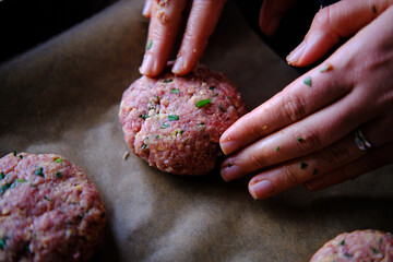 Preparing burger patties, raw burger meat. Concept for making homemade burgers.