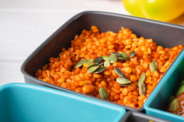 Close up photo of plastic lunch box with cooked food