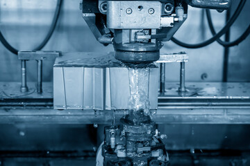 The operation of  wire-EDM machine cutting the die insert parts. The hi-technology of mild and die manufacturing process by wire cut machine.