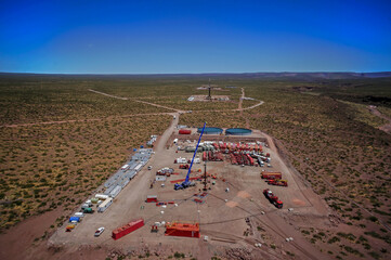 Vaca Muerta, Argentina, November 202, 2015: Extraction of unconventional oil. Battery of pumping trucks for hydraulic fracturing.
