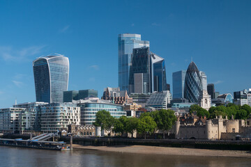 Fototapeta na wymiar City of London financial district seen from Tower Bridge New office towers glint in the morning sunshine.