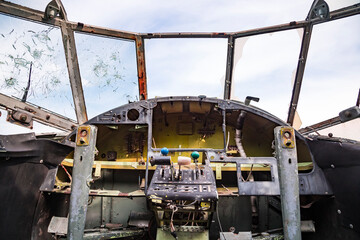 View from the cockpit of old ruined aircraft Antonov An-2 at abandoned Airbase aircraft cemetry in...
