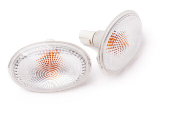 Sale of spare parts during auto-parsing or car body repair after an accident and breakdown in service on a white isolated background in a photo studio - a couple of additional turn signals.