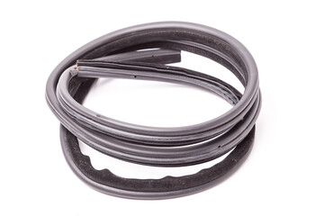 Fototapeta premium Black rubber compressor for element body, doors or trunk, heat and sound insulation, preventing heat loss in passenger compartment. Sealing gasket for replacement during rewind or sale at auto-parsing