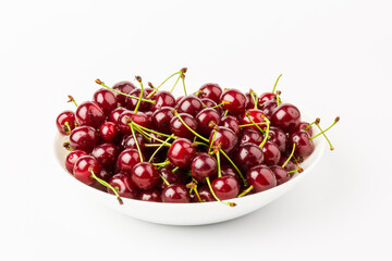 fresh red cherry fruit in plate  isolated on white background