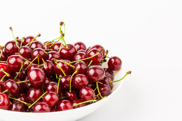 fresh red cherry fruit in plate  isolated on white background