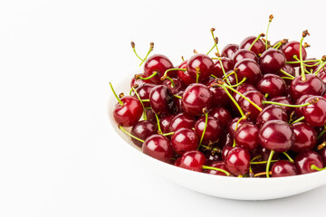 fresh red cherry fruit in plate  isolated on white background