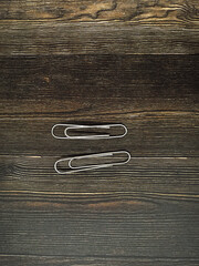 paper clips on wooden background