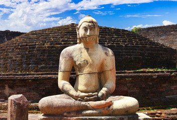 Fototapeta premium Sri Lanka travel and landmarks - ancient city of Polonnaruwa, UNESCO World Heritage Site. Buddha statue in Vatadage temple