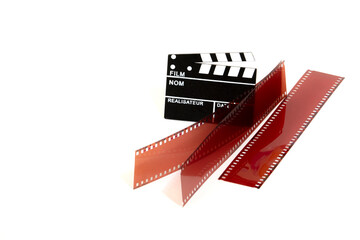 Right side Film stripes with clapperboard and negative on white background