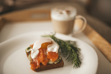 Cappuccino with avocado salmon egg toast