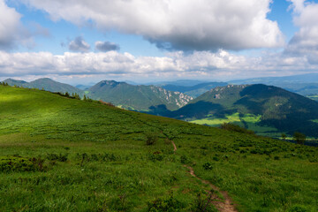 Green ridge in mountain and blue cloud sky. Composition of nature. Spring ountain. Composition of nature. Slovakia little fatra europe