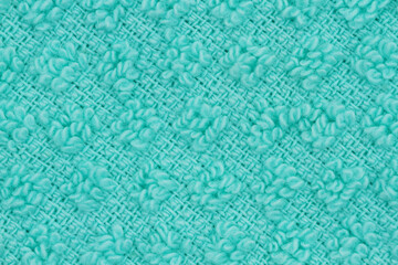 Obraz premium Teal knit textured weave material background