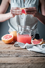 fresh-squeezed grapefruit juice drink on wood table