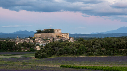 Fototapeta na wymiar Château de Grignan on a backdrop of lavender fields in Provence