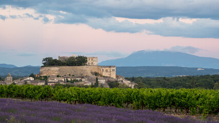Fototapeta na wymiar Château de Grignan on a backdrop of lavender fields in Provence