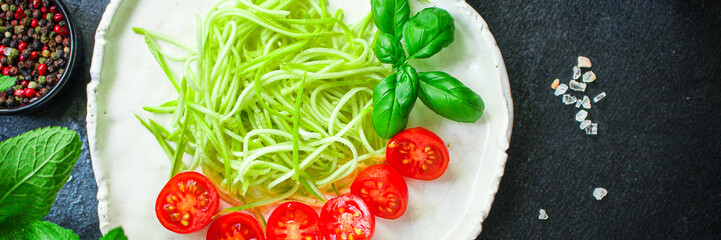 zucchini spaghetti salad tomato vegetables Menu concept serving size. food background top view copy space organic healthy eating keto or paleo diet