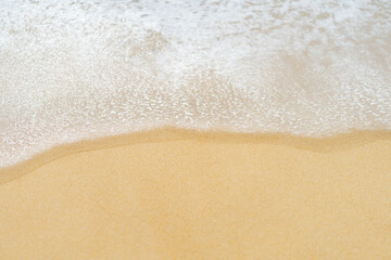 close up sand beach with blue sea wave background