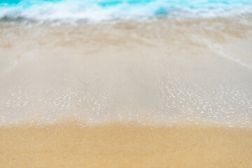 close up sand beach with blue sea wave background