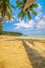 Paradise Sunny beach with palms and turquoise sea. Summer vacation and tropical beach concept.