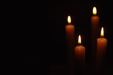 Burning candle Wick from a candle in a flame of fire. Symbol of sadness and loneliness. A time of condolences. Burning wax candle. Religion.