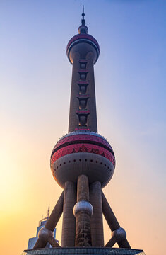 Shanghai, China - June 16, 2013: City skyline and Oriental Pearl Tower at sunset through heavy smog in the air. Pollution is a common issue in China