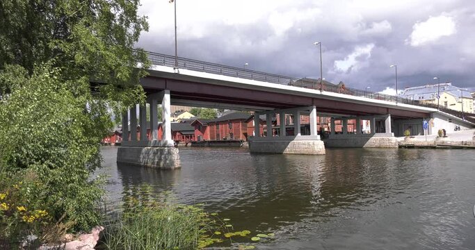 4K video of Porvoo vintage red wooden buildings, Porvoo Cathedral, yachts and boats in Porvoonjoki River near town center on sunny summer day in Finland, northern Europe