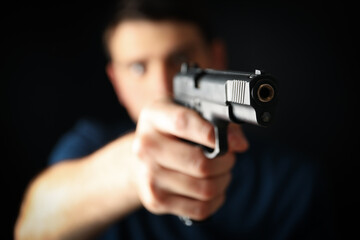 Fototapeta na wymiar Man hold pistol. Selective focus. Self defense weapon