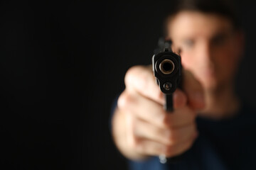 Man hold pistol. Selective focus. Self defense weapon