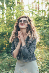 
Portrait of a girl in glasses in the woods
