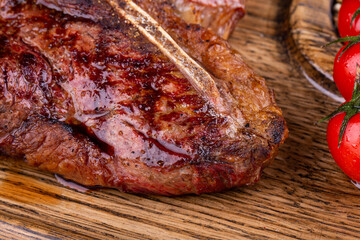 Fried meat on bone, with spices and tomatoes