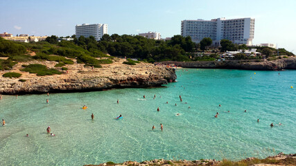 People in the water on Cala Domingos Beach, Calas de Mallorca, Spain