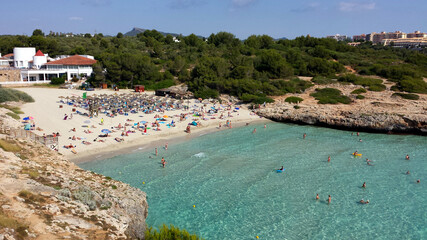 People in the water on Cala Domingos Beach, Calas de Mallorca, Spain
