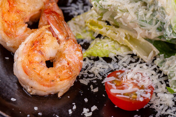 Shrimp fried in butter with cheese and tomatoes
