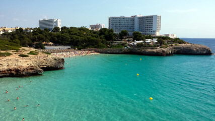 People in the water on Cala Domingos Beach, Calas de Mallorca, Spain