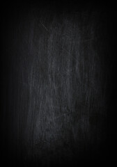 Dark, grunge and scratched black texture may used as background