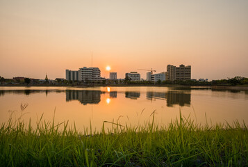 Fototapeta premium Sunset with lake in Public Park landscape