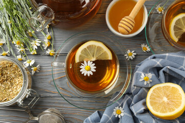 Obraz na płótnie Canvas Composition with chamomile tea on gray wooden background