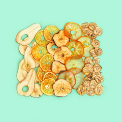 Diet Healthy snack, set of dried fruits. Dehydrated fruit chips of apple, banana, persimmon, tangerine, pear. Trendy food for vegetarian. Top view.