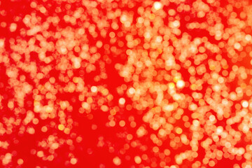 Golden Shine on red background. Bokeh pattern texture red color.