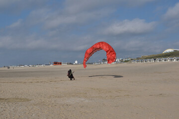 Paragliding at the beach of Katwijk aan Zee. Paraglider's making use of updraft of the dunes to stay in the air 