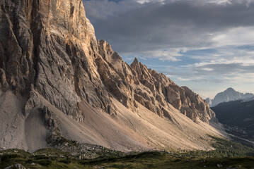 Spectacular view of Civetta mountain range with Civetta summit at its center from the terrace of Tissi refuge at the golden hours before sunset, Dolomites, Alleghe village, Belluno province, Italy.