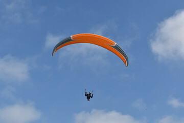 Paragliding at the beach of Katwijk aan Zee. Paraglider's making use of updraft of the dunes to stay in the air 