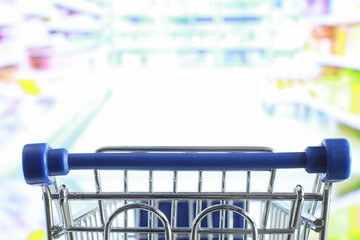 Background shopping trolley. Concept of shopping for groceries and things. Weekend shop.