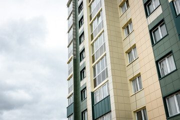 Fototapeta premium Residential buildings with balconies in the city, urban development of apartment houses.
