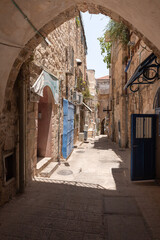 Fototapeta na wymiar Old buildings on Suq El Qatanin Street in the Arab Quarter in the old city of Jerusalem, Israel