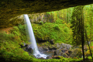 The trail goes behind the North Falls in Silver Falls State park near Silverton, Oregon