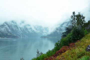 Side view of a lake with mountains in the background