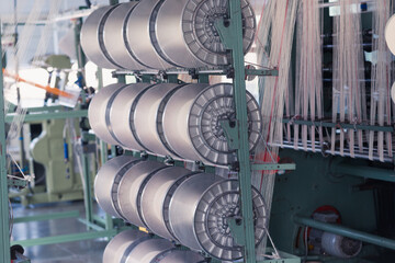 mechanical equipment at a garment factory. thread manufacturing tools.